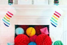 bright paper balls filling the fireplace, striped stockings, Christmas trees with colorful pompoms and bold silhouettes