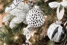 fabulous pola dot and marble black and white Christmas ornaments and striped black and white garlands are amazing for Christmas tree styling