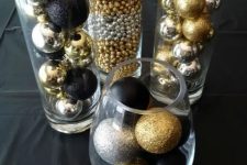 glass vases and bowl with assorted silver, gold and black Christmas ornaments, matte, glitter and glossy ones is a great decoration itself