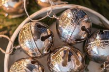 oversized silver Christmas bells are amazing Christmas ornaments that will add a catchy and shiny touch to your tree