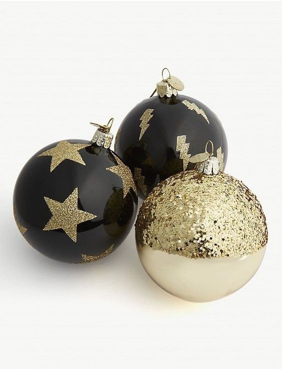 stylish black and white ornaments with gold glitter touches are a cool solution for winter holidays
