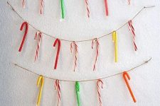 twine with colorful candy canes is a fun and bright idea of Christmas or holiday decor to rock and it can be easily done yourself