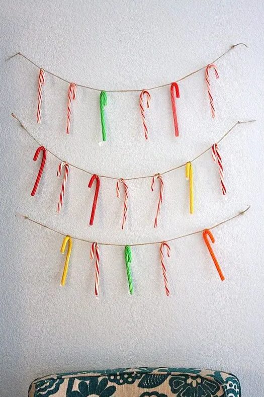 twine with colorful candy canes is a fun and bright idea of Christmas or holiday decor to rock and it can be easily done yourself