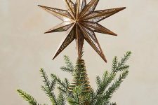 02 a classic dark metallic star tree topper is an ideal that always works for an elegant and chic Christmas tree