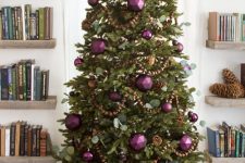 02 a fabulous Christmas tree decorated with usual and faceted Christmas ornaments, greenery, wooden beads and pinecones is a fresh take on traditional rustic decor