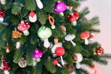 04 a Christmas tree decorated with lots of colorful mushrooms and berries is a fin and cool idea for a woodland celebration