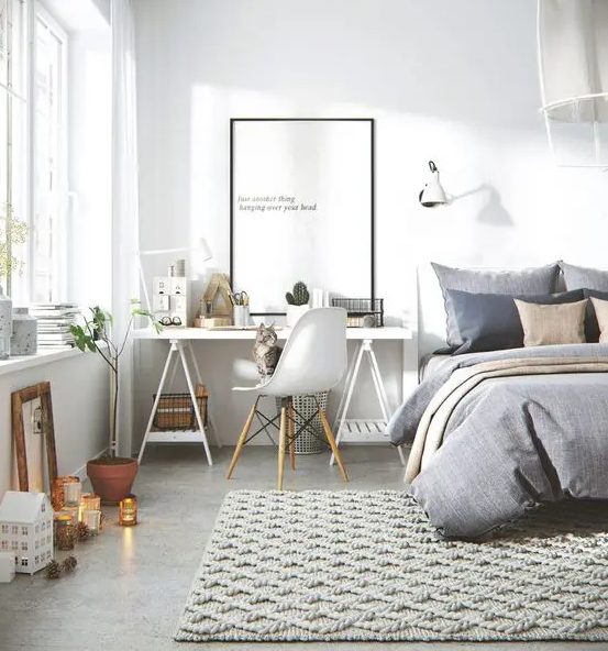 a modern Scandinavian bedroom with a workspace next to the bed, a sawhorse desk is a practical option