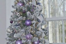 05 a flocked mini Christmas tree with silver, white and lilac ornaments, ribbons and gold touches is a very chic and lovely idea