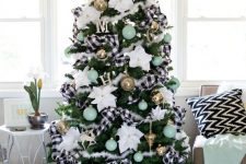 07 a bright Christmas tree with buffalo check ribbons, gold and mint ornaments, white fabric blooms all over is dreamy