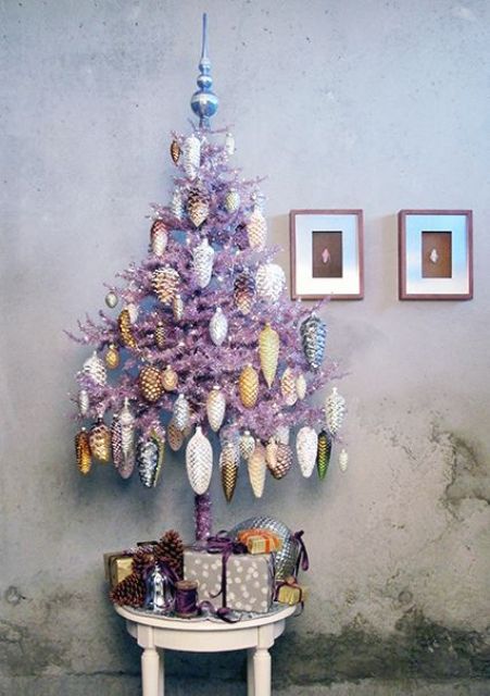 a lilac Christmas tree with silver, white, gold and yellow pinecone-shaped ornaments is a creative idea to stand out at Christmas