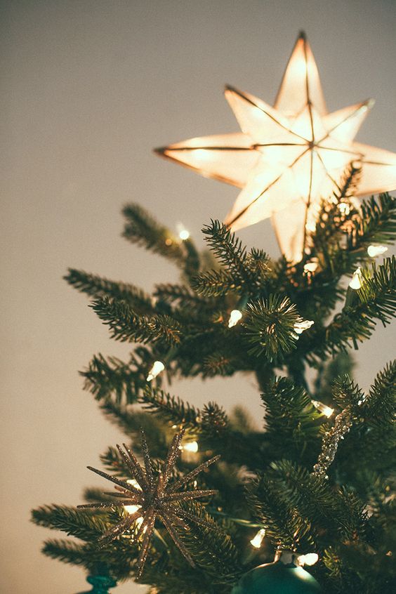 a shining star tree topper is a fresh and modern take on classics, just add lights and you will need no other decor for your tree