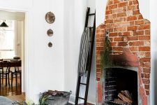 08 a creative asymmetrical red brick fireplace is a unique feature to go for, it’s a bold solution that looks rough and unusual