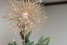 08 a super shiny gold glitter burst star tree topped with pearls is a refined and chic solution for your Christmas tree