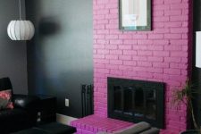 09 a moody living room with a hot pink brick fireplace that brings much color and makes the space playful