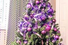 09 a shiny and glam Christmas tree with fuchsia and purple ornaments, ribbons, lights and gifts in matching boxes is amazing