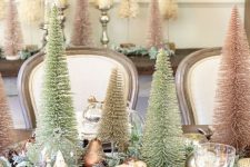 09 an elegant Christmas tablescape with faux evergreens, bottle brush trees, metallic and glitter ornaments, metallic placemats and chic cutlery