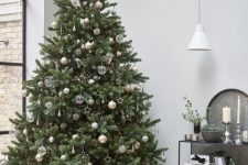 10 a delicate neutral Christmas tree with white, gold, silver and semi sheer ornaments, shiny stars and beads plus lights is gorgeous