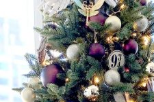 12 a bright Harry Potter christmas tree topped with an owl bringing a newspaper is a gorgeous and chic idea for a geeky space