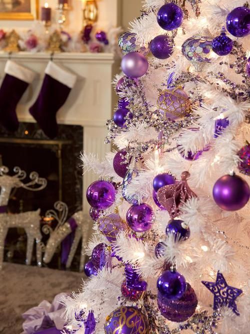 a white Christmas tree decorated with lilac and bright purple ornaments, lights and sequins is a super glam and bold idea to rock