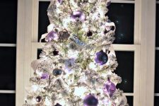 13 a white Christmas tree decorated with white, lilac and purple ornaments, garlands and lights is a very cool and chic idea