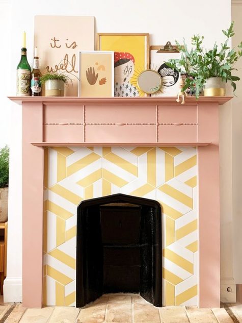 a cheerful fireplace with hex striped tiles around and a pink mantel plus quirky art looks very unusual