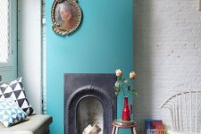 15 a chic nook with a shabby chic brick wall, a vintage fireplace with a bold blue surround, a doily rug and an upholstered bench