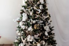 16 a woodland Christmas tree with faux owls, deer, snowflakes, silver, white and pearly ornaments, branches, lights and letters
