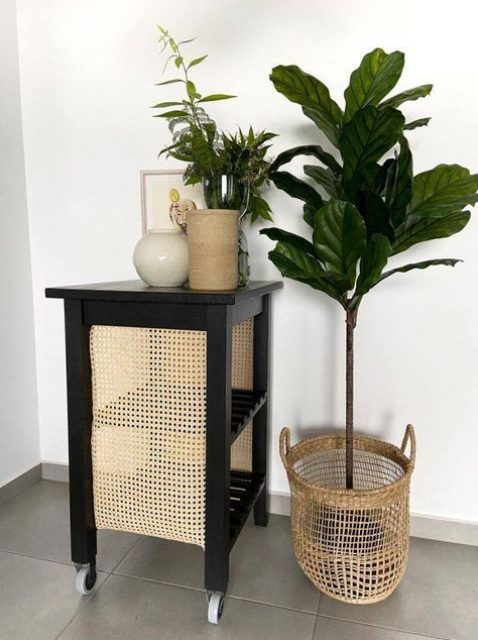 a gorgeous rustic IKEA Bekvam hack with black paint and rattan net is a super stylish solution for a modern space