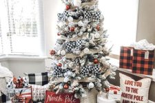 18 a farmhouse Christmas tree with mesh and buffalo check ribbons, white and red ornaments, branches and elegant pillows