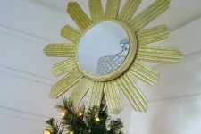 19 a gold glitter sunburst mirror tree topper is a refined and chic art deco solution to glam up the Christmas tree