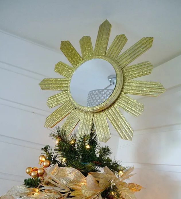 a gold glitter sunburst mirror tree topper is a refined and chic art deco solution to glam up the Christmas tree