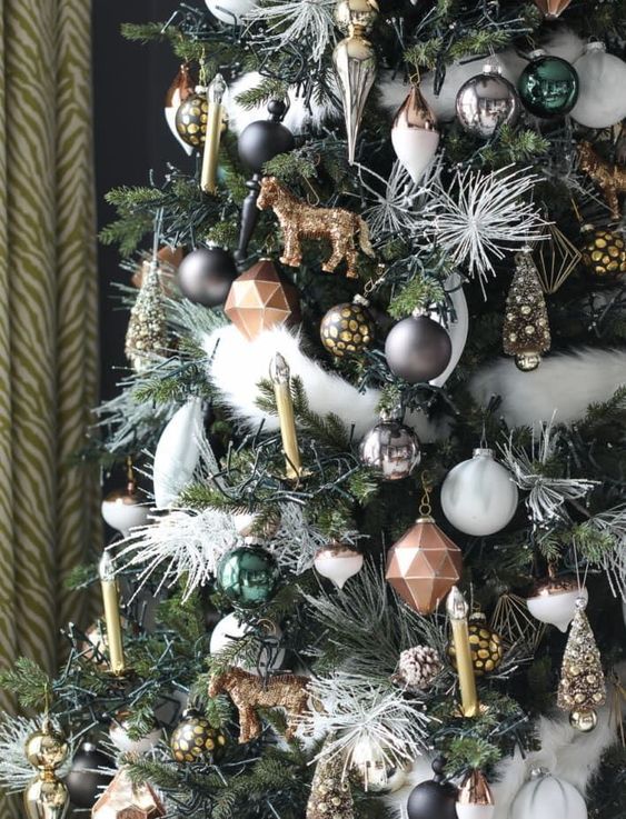 lovely woodland-themed Christmas tree decor with pinecones, silver, green, black and copper ornaments, faux candles and animal figurines