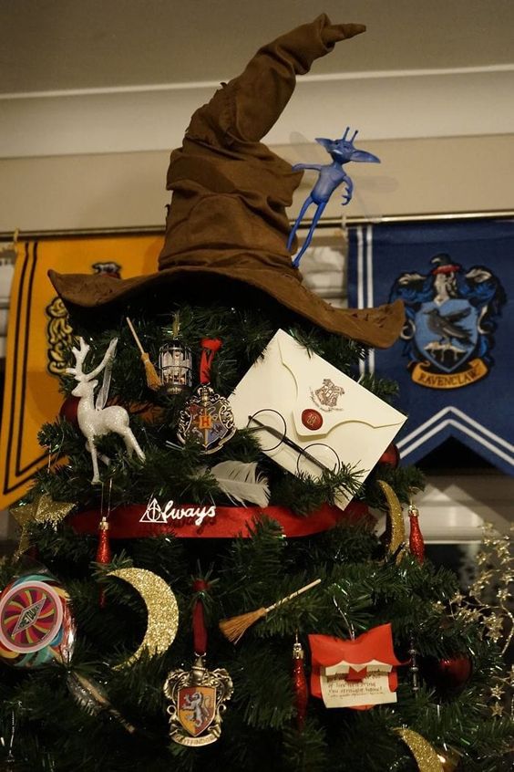 a Harry Potter themed Christmas tree topped with Sorting Hat is a fantastic idea perfectly style for the holidays