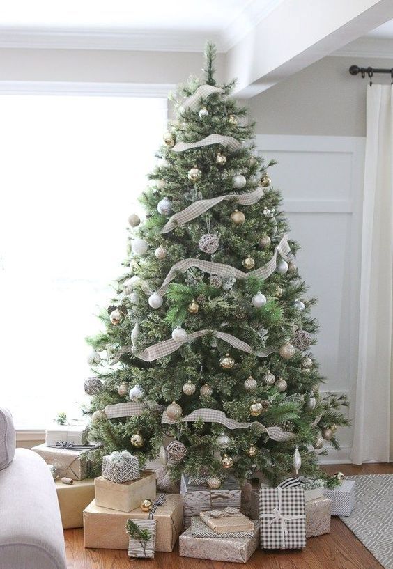a subtle neutral Christmas tree with gold, silver and light green ornaments, lights, plaid ribbons and vine ornaments is a chic idea