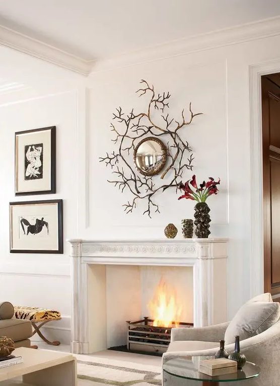 a neutral sophisticated living room with elegant furniture and a low coffee table, a large vintage fireplace with a modern ethanol one inside it