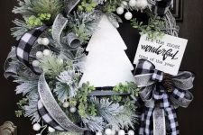 a stylish front door Christmas wreath