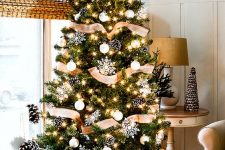 24 lovely rustic Christmas tree decor with burlap ribbons, snowy pinecones, white ornaments and snowflakes is chic