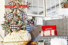 25 a buffalo check loveseat, a Christmas tree with buffalo check ornaments and plaid and buffalo check ribbons