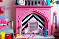 25 a quirky colorful living room finished off with a hot pink faux fireplace with colorful accessories on the mantel