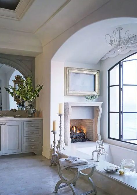 a cute bathroom with an antique fireplace