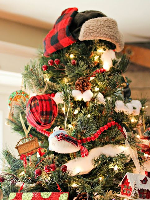 a plaid and faux fur hat on top your Christmas tree is a fantastic and super fun solution for a rustic Christmas tree