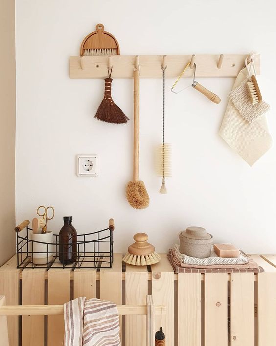 all-natural home decor of light-stained pallets and a wooden rack - reuse of materials is important