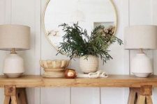 29 a farmhouse console table and baskets for storage is a cool idea for a farmhouse entryway or living room