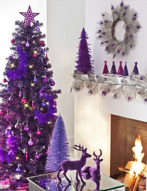 super bold purple Christmas decor with a purple tree, with fuchsia and purple ornaments, purple deer, mini trees and a wreath in silver and purple