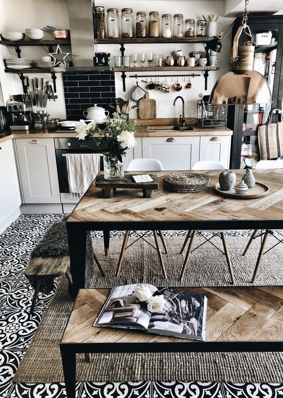 a dining set clad with reclaimed wood with a herringbone pattern is a stylish idea for a Scandi or farmhouse space