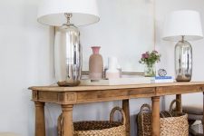 31 a beautiful console table made of reclaimed wood and old banisters is a gorgeous idea for a farmhouse space