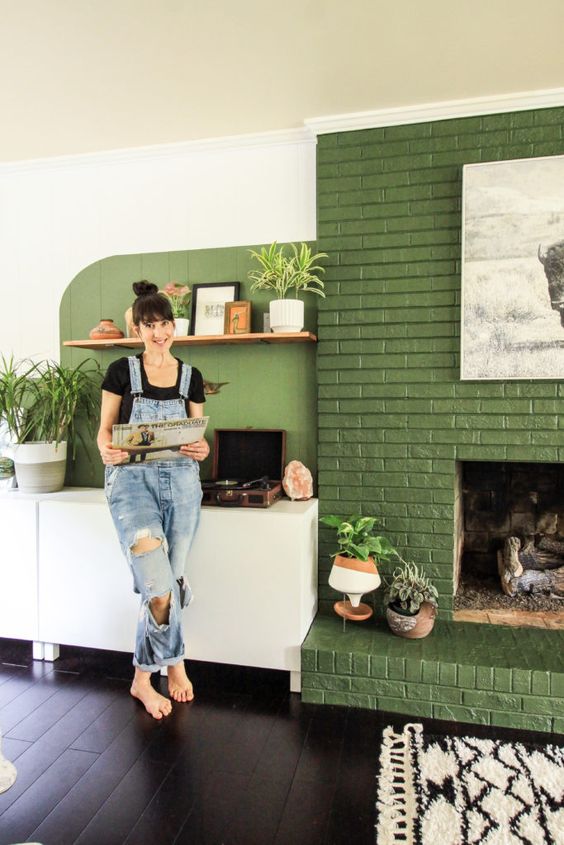 a green painted brick fireplace is a chic and natural color touch to your space, which will make it more inviting
