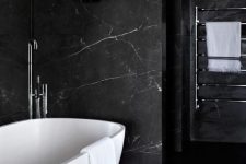a luxurious bathroom design with a marble wall