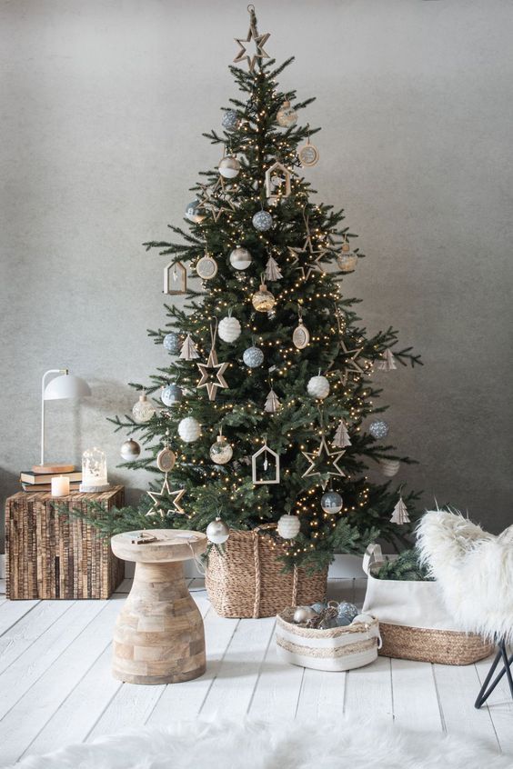 a modern and chic Christmas tree with white, grey and sheer ornaments, plywood stars, houses and lights is amazing
