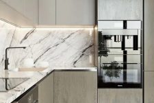 38 an elegant modern two-toned kitchen with a black and white marble backsplash and countertop for a refined feel